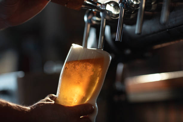 Beer pouring from tap image